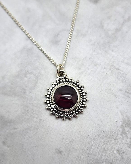 Round Sunburst Garnet Necklace - January Birthstone