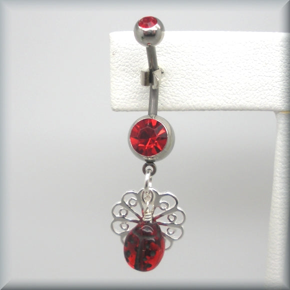 Red crystal belly ring with ladybug on flower