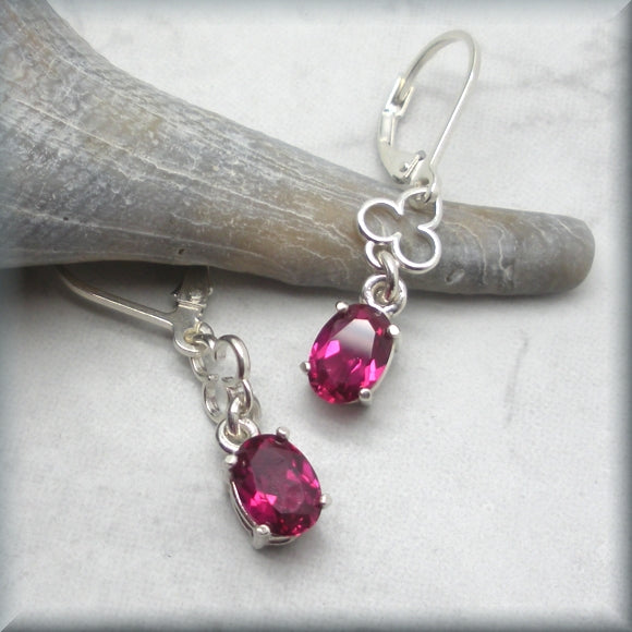 faceted oval ruby leverback earrings