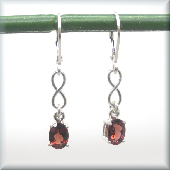 
                  
                    oval cut garnet earrings in sterling silver
                  
                