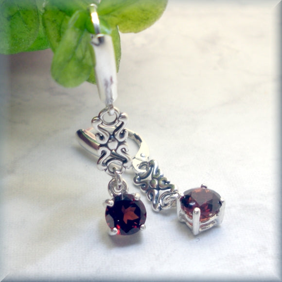 
                  
                    faceted round garnet earrings in sterling silver
                  
                