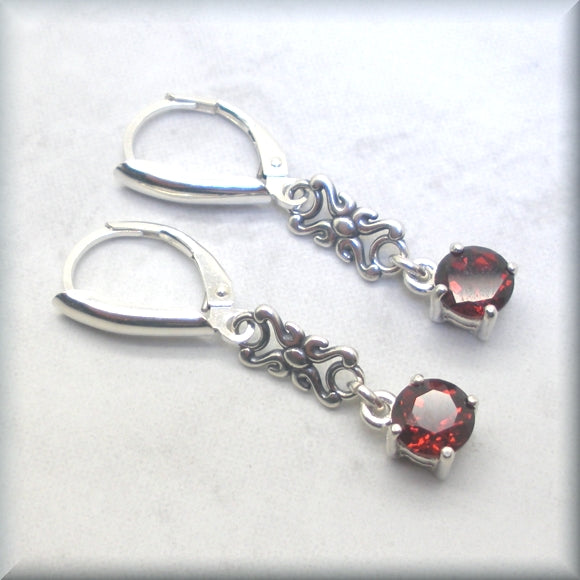 
                  
                    January birthstone earrings with round garnet stones
                  
                