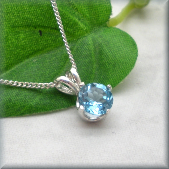 round swiss blue topaz pendant by Bonny Jewelry