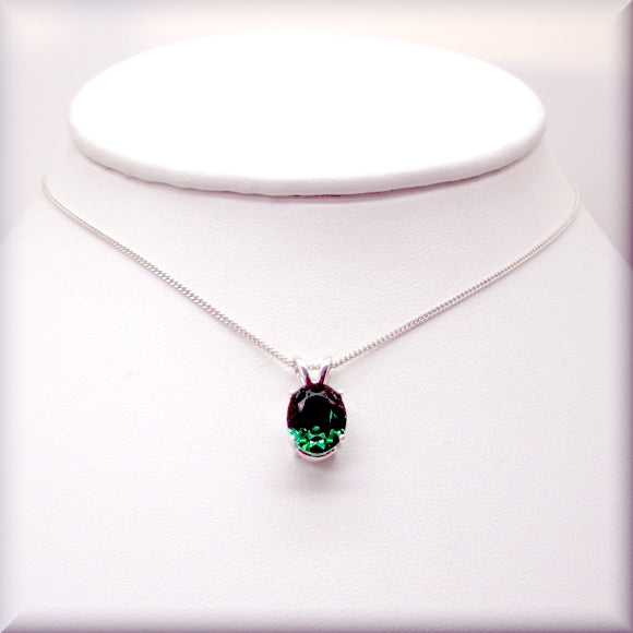 Vibrant emerald necklace in an oval cut with sterling silver chain