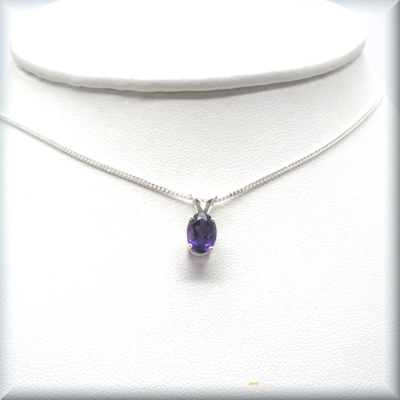 
                  
                    oval amethyst necklace on display bust
                  
                
