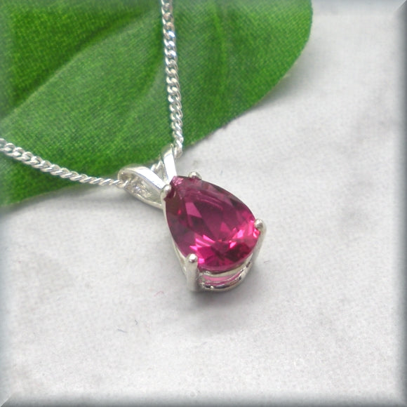 Ruby gemstone necklace in sterling silver basket setting