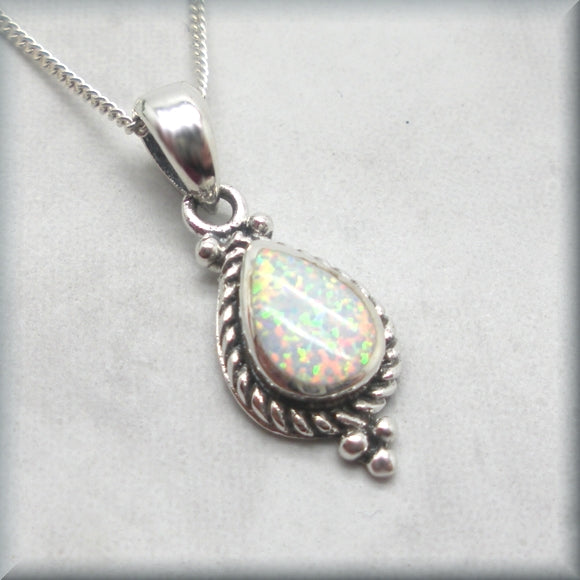 white opal cabochon pendant with rope detail edge